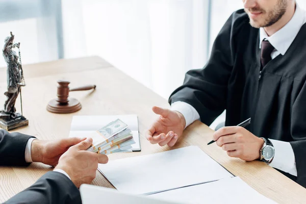 Cropped View Man Giving Money Judge Sitting Table — Stock Photo, Image