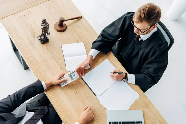 Top View Man Giving Cash Judge Sitting Office — Stock Photo, Image