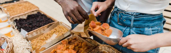 Panoramic Shot Woman Holding Metal Scoop Dried Apricots African American — Stock Photo, Image