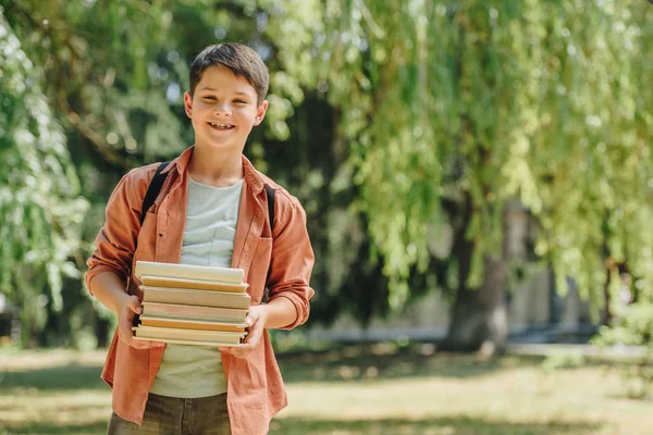 Smiling Schoolboy Looking Camera While Standing Park Holding Books — Stock Photo, Image