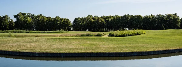 Panoramic Shot Green Grass Trees Pond Blue Sky — Stock Photo, Image