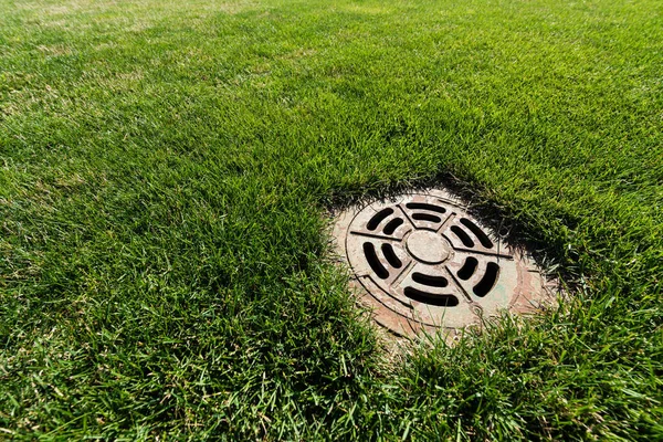Metallic Manhole Cover Green Fresh Grass — Stock Photo, Image