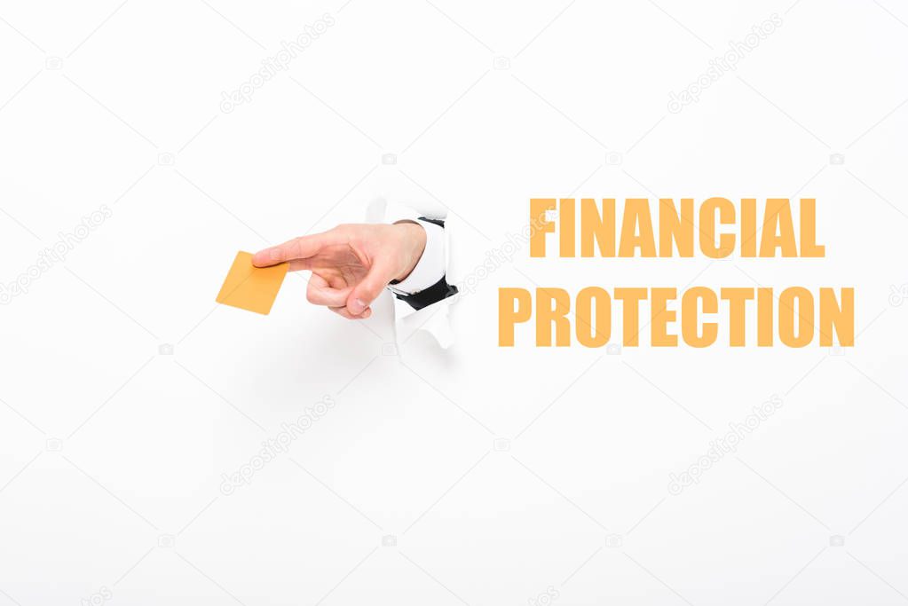 Cropped view of man holding empty business card from hole in white paper with financial protection illustration