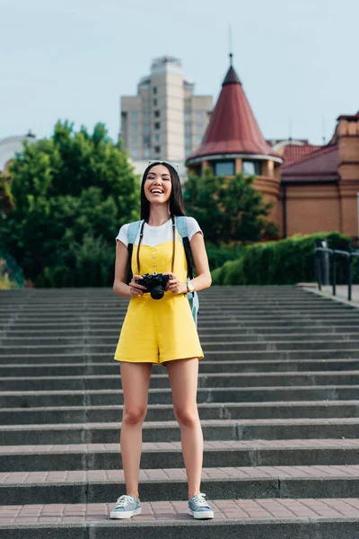 Attractive Asian Woman Overalls Holding Digital Camera Looking Camera — Stock Photo, Image