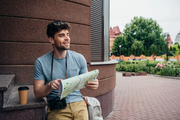 Smiling Handsome Man Glasses Holding Map Looking Away — Stock Photo, Image