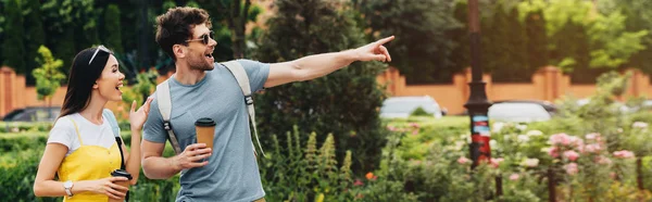 Panoramic Shot Handsome Man Pointing Finger Asian Woman Holding Paper — Stock Photo, Image