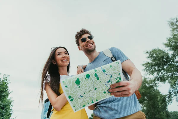 Handsome Man Holding Map Asian Woman Looking Away — Stock Photo, Image