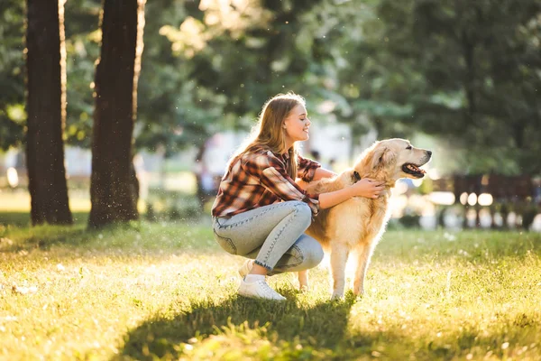 Side View Beautiful Girl Casual Clothes Petting Golden Retriever While — Stock Photo, Image