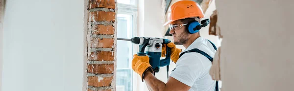 Panoramic Shot Handyman Uniform Yellow Gloves Using Hammer Drill — Stock Photo, Image
