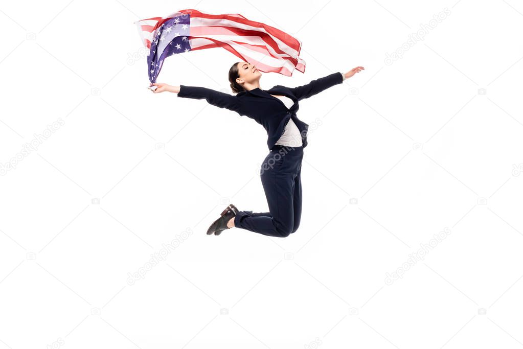 young businesswoman jumping in dance while holding usa national flag isolated on white