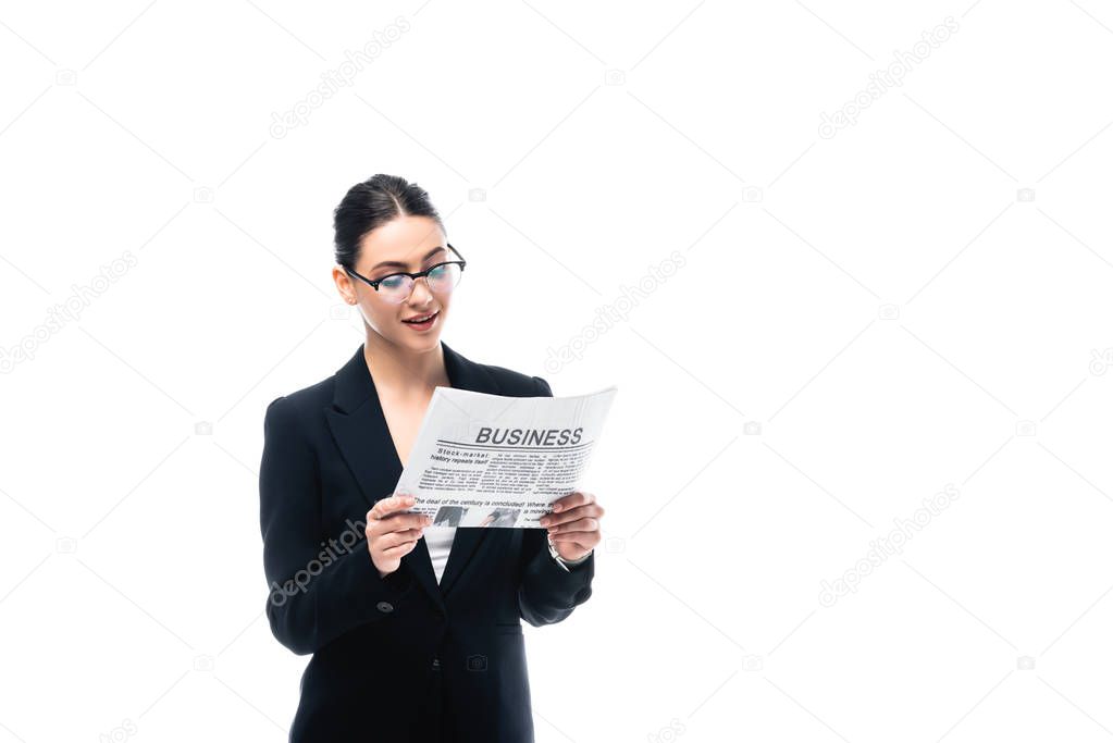 elegant businesswoman in glasses reading business newspaper isolated on white