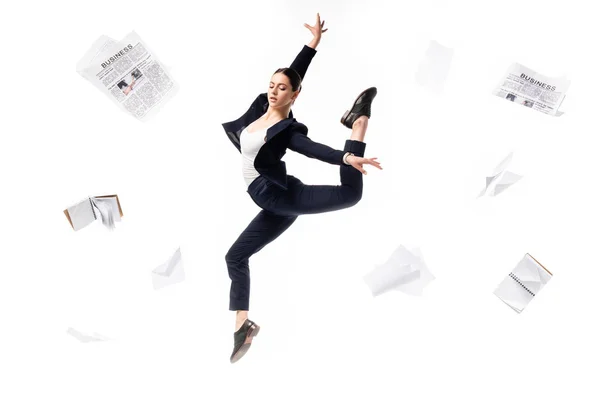 Elegant Businesswoman Dancing Surrounded Newspapers Notebooks Papers Flying Isolated White — Stock Photo, Image