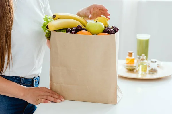 Cropped View Young Woman Standing Paper Bag Fruits — Stock Photo, Image