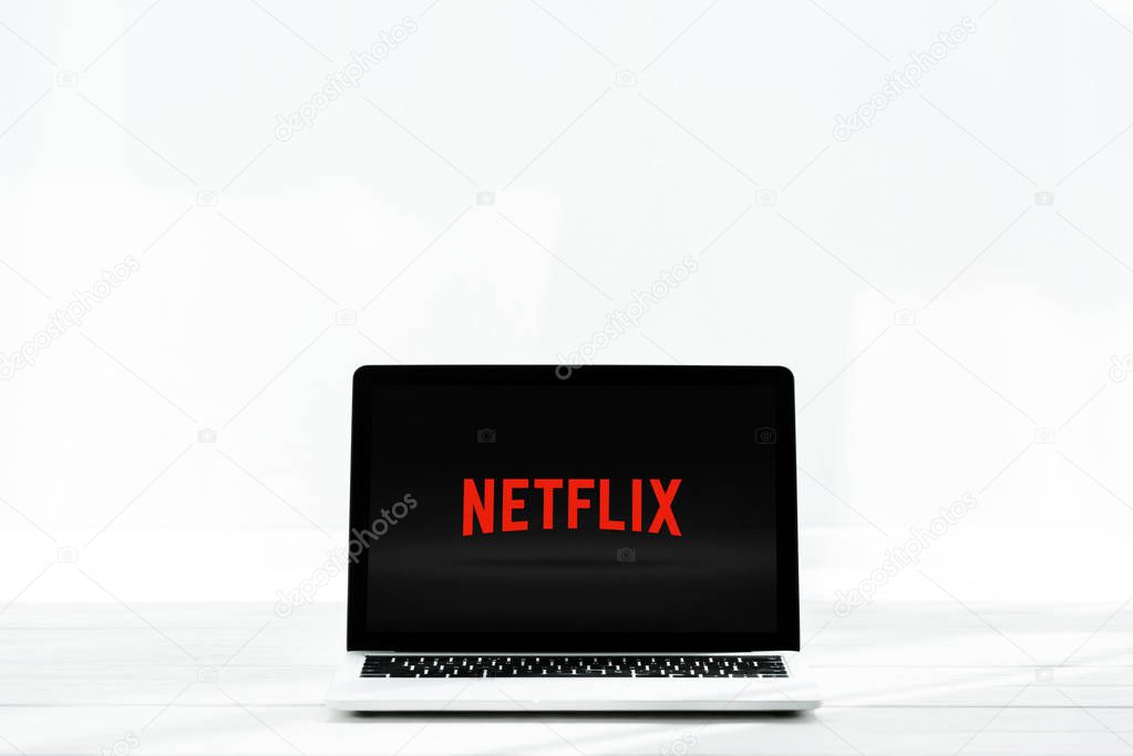 KYIV, UKRAINE - JULY 23, 2019: modern laptop with netflix website on screen on white