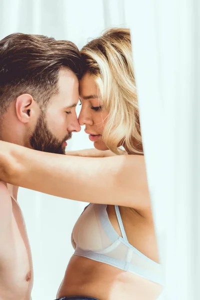 Young Couple Hugging Closed Eyes While Standing Window Home — Stock Photo, Image