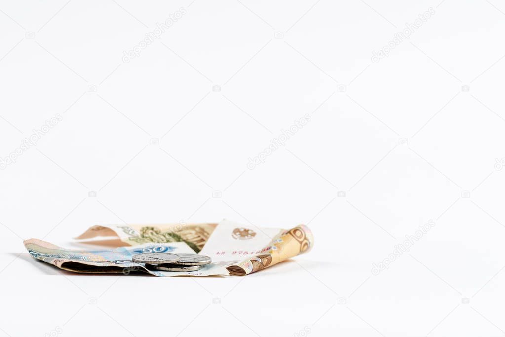 selective focus of rubles and coins isolated on white 