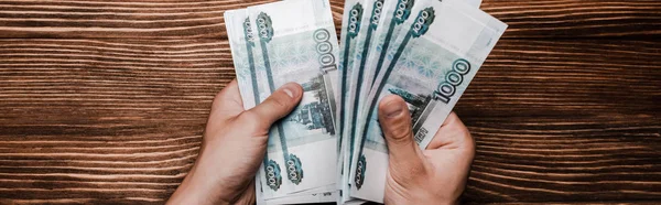 Panoramic Shot Man Holding Russian Money Table — Stock Fotó