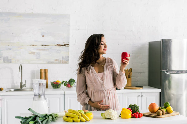 happy young woman holding apple near tasty food 