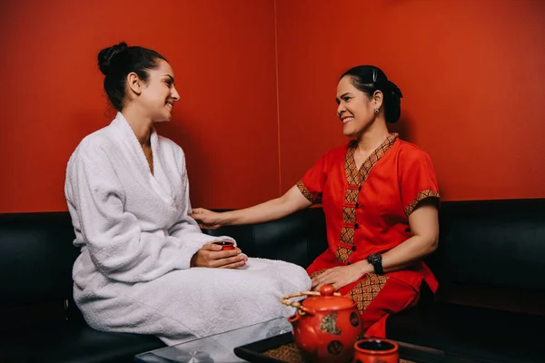 Smiling Woman Bathrobe Asian Masseur Talking Spa — Stock Photo, Image