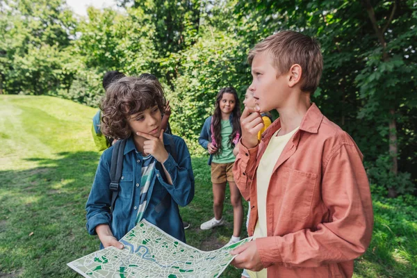 Selective Focus Thoughtful Boys Holding Map Friends — Stock Photo, Image