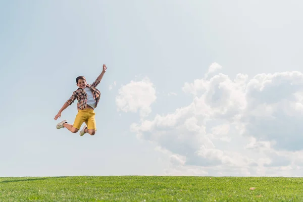 Happy Boy Jumping Gesturing Blue Sky — Stock Photo, Image