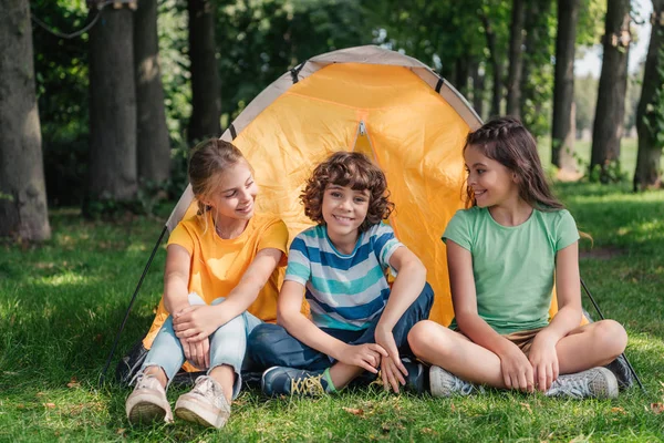Positive Curly Boy Sitting Cute Friends Camp — Stock Photo, Image