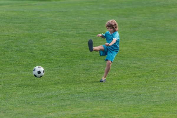 Curly Boy Sportswear Playing Football Green Grass — Stock Photo, Image