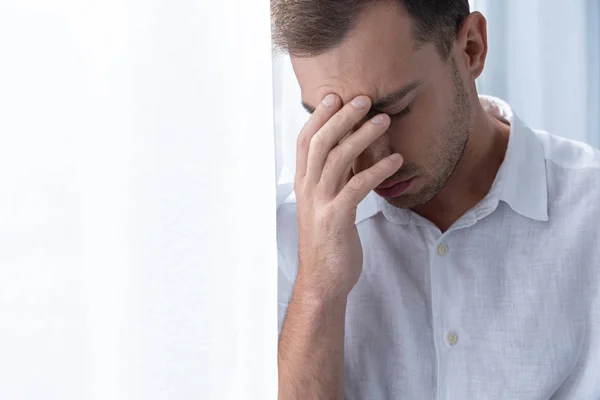 Depressed Man White Shirt Touching Forehead Closed Eyes — Stock Photo, Image