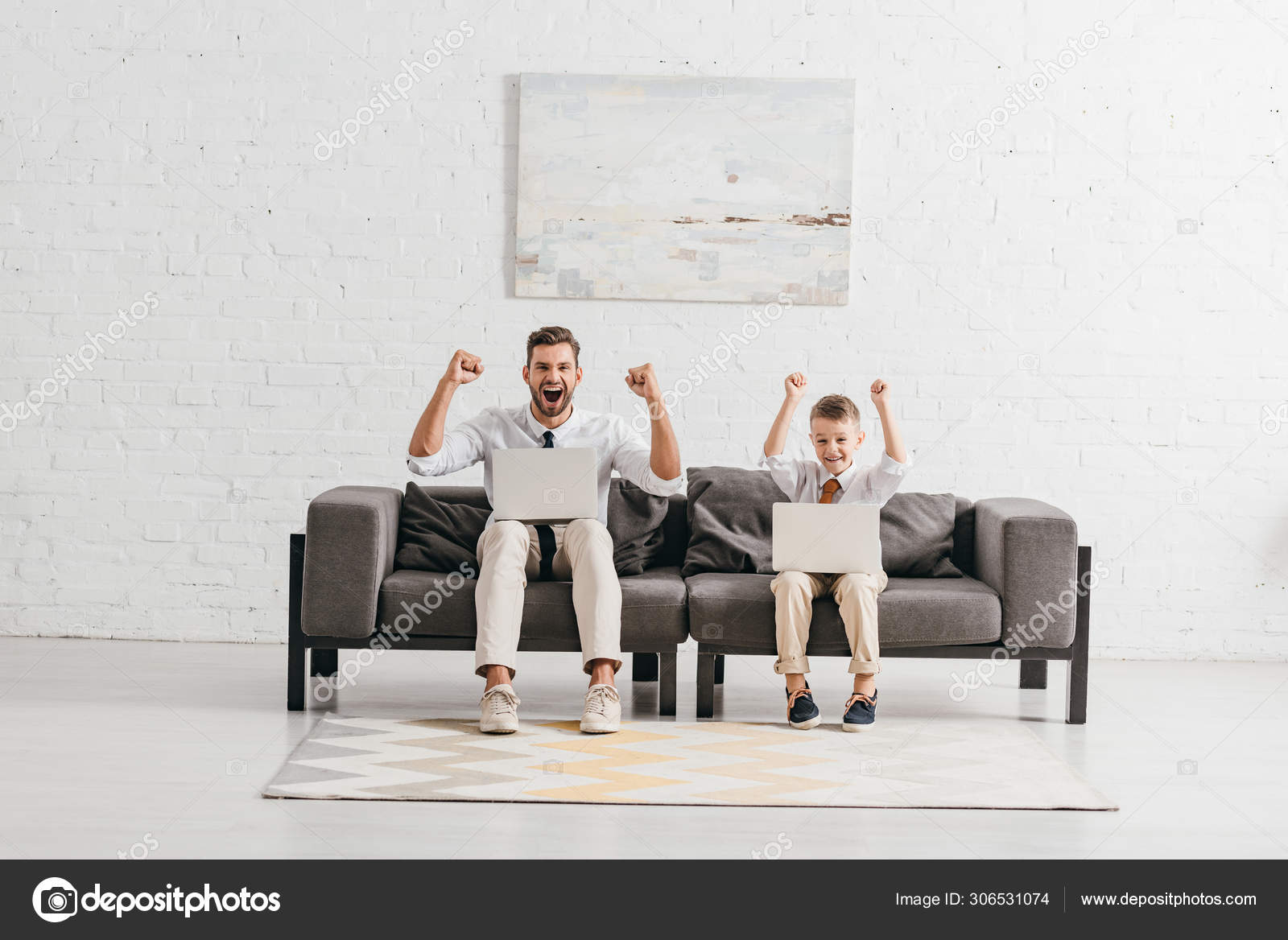Dad Son Formal Wear Using Laptops Showing Yes Gestures While Stock