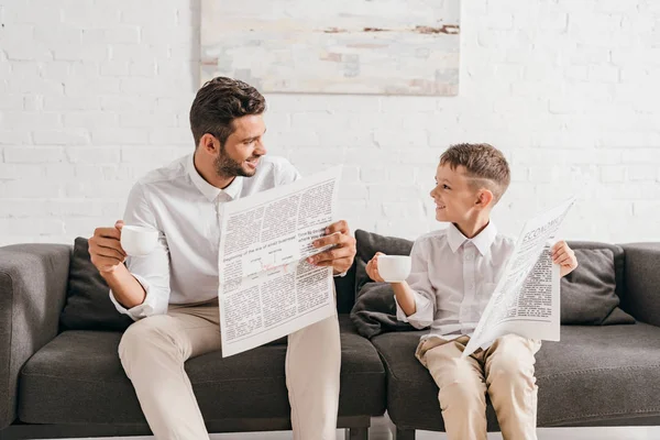 Son Dad Formal Wear Sitting Sofa Reading Newspapers — Stock Photo, Image