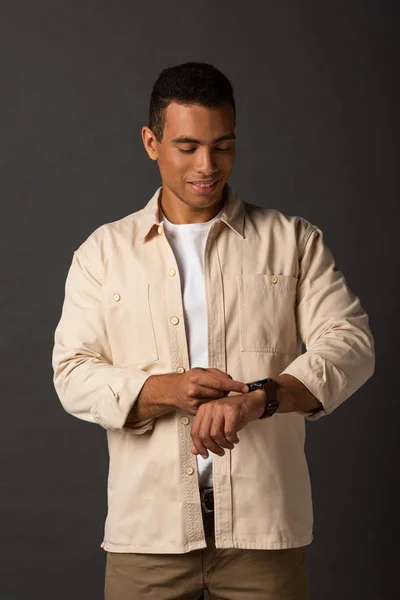 Smiling Handsome Mixed Race Man Beige Shirt Looking Wristwatch Black — Stock Photo, Image