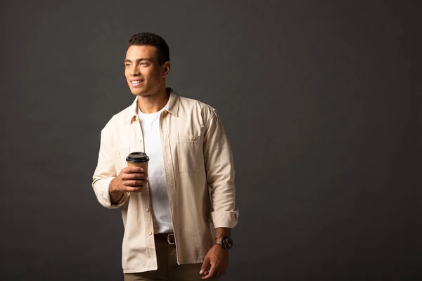 Smiling Mixed Race Man Beige Shirt Holding Coffee Black Background — Stock Photo, Image