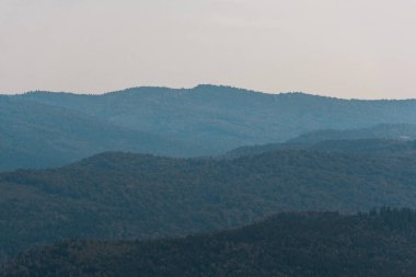 scenic landscape with green mountains against sky  clipart