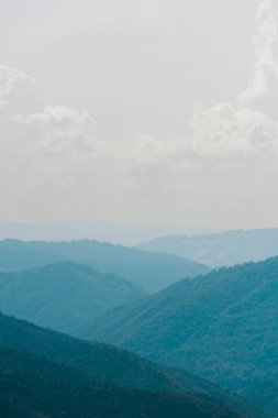 tranquil mountain valley against sky white white clouds  clipart