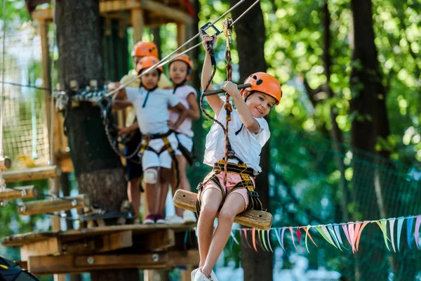 Selective Focus Kid Riding Cable Car Multicultural Friends — Stock Photo, Image