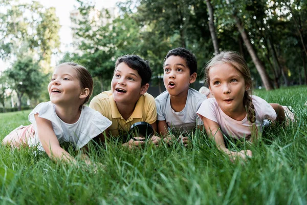 Selective Focus Surprised Multicultural Children Lying Grass — Stock Photo, Image