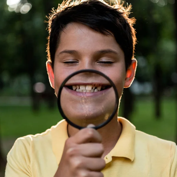 Selective Focus Cheerful Boy Holding Magnifier Face — Stock Photo, Image