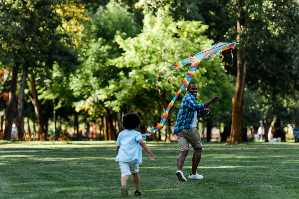 Selective Focus Happy African American Father Looking Son While Running — Stock Photo, Image