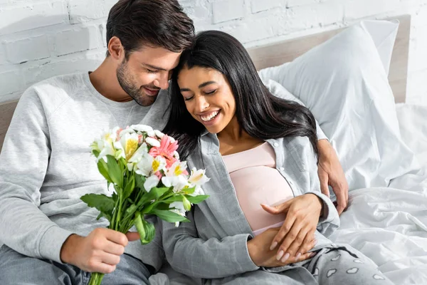Handsome Man Holding Bouquet Hugging His Smiling Pregnant African American — Stock Photo, Image