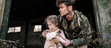 panoramic shot of scared man and child with teddy bear outside, post apocalyptic concept clipart