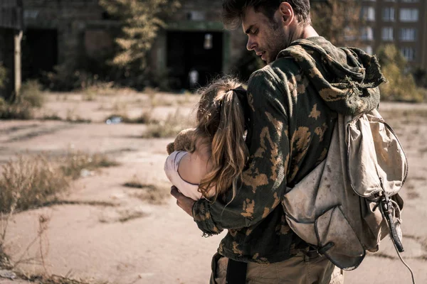 Handsome Man Backpack Holding Arms Child Post Apocalyptic Concept — Stock Photo, Image