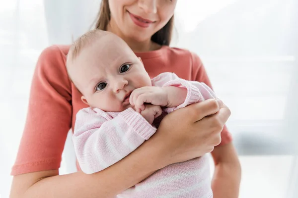 Cropped View Happy Woman Holding Arms Adorable Infant Daughter — Stockfoto