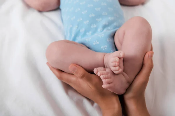 Cropped View Caring Mother Touching Legs Cute Baby Bodysuit — Stock Photo, Image