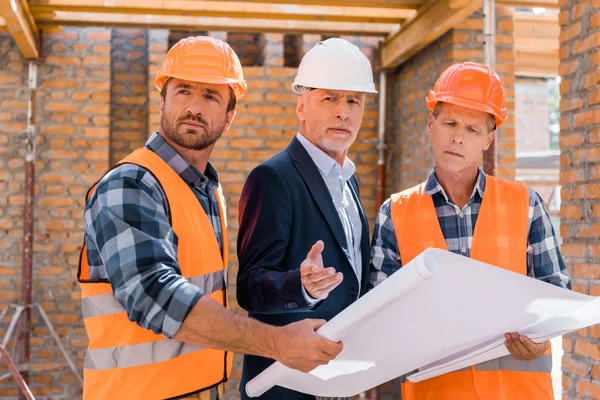 Constructors Holding Blueprint Mature Businessman Suit — Stock Photo, Image