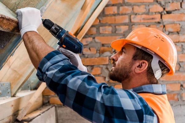 Side View Handsome Constructor Helmet Holding Hammer Drill — Stock Photo, Image