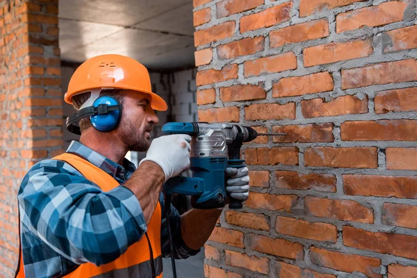 Handsome Constructor Helmet Holding Hammer Drill — Stock Photo, Image