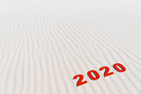 2020 numbers on white sand on beach in Maldives