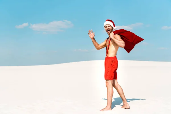 Handsome Sexy Man Santa Hat Holding Santa Sack Waving Beach — Stock Photo, Image