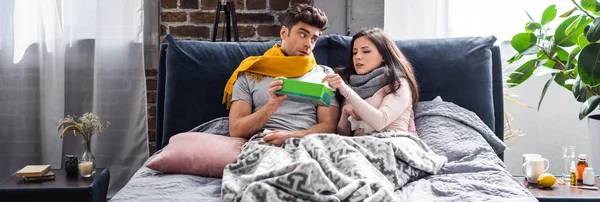 Panoramic Shot Sick Girlfriend Taking Napkin Boyfriend Holding Box Apartment — Stock Photo, Image