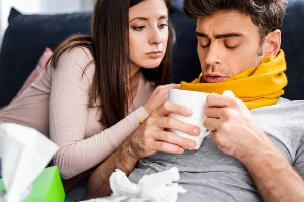 Girlfriend Looking Sick Boyfriend Scarf Cup Tea — Stock Photo, Image